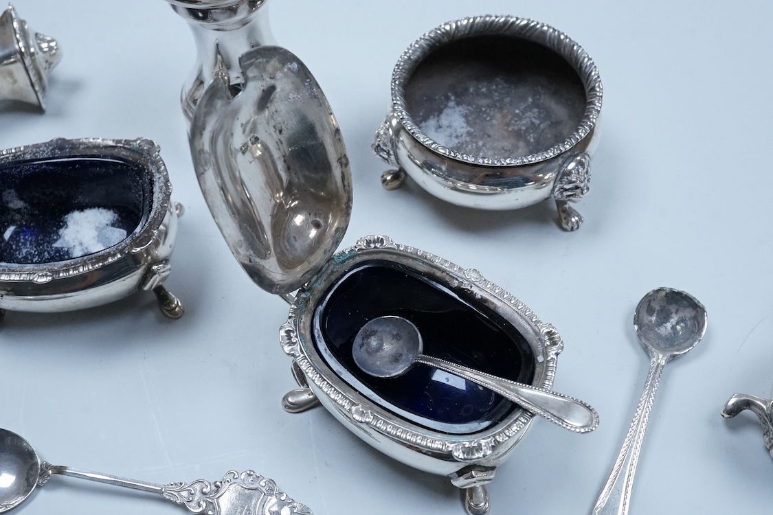 Two George VI silver three piece condiment sets by Walker & Hall, London, 1936/7, together with a modern silver mounted pepper mill by Mappin & Webb and two plated spoons.